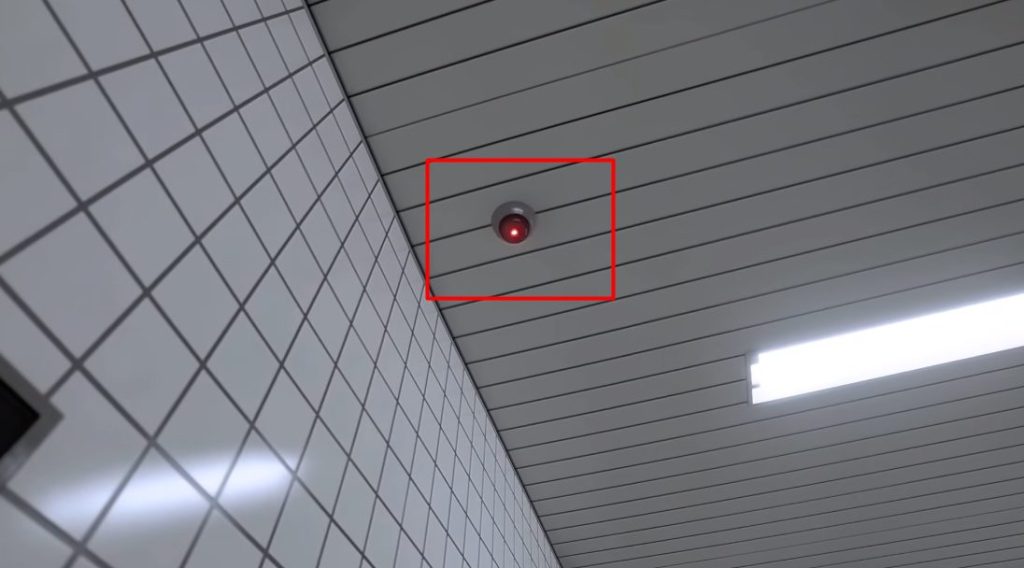 6: Red light on security camera. the exit 8