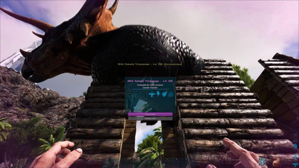 Ark Survival Evolved: Can You Tame A Creature While It's Tranquilized? - Tranquilized dinosaur being tamed inside a trap.