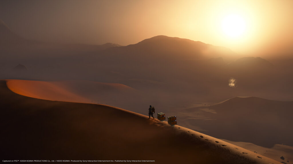 Death Stranding 2: On the Beach promotional shot showing Sam walking across the desert